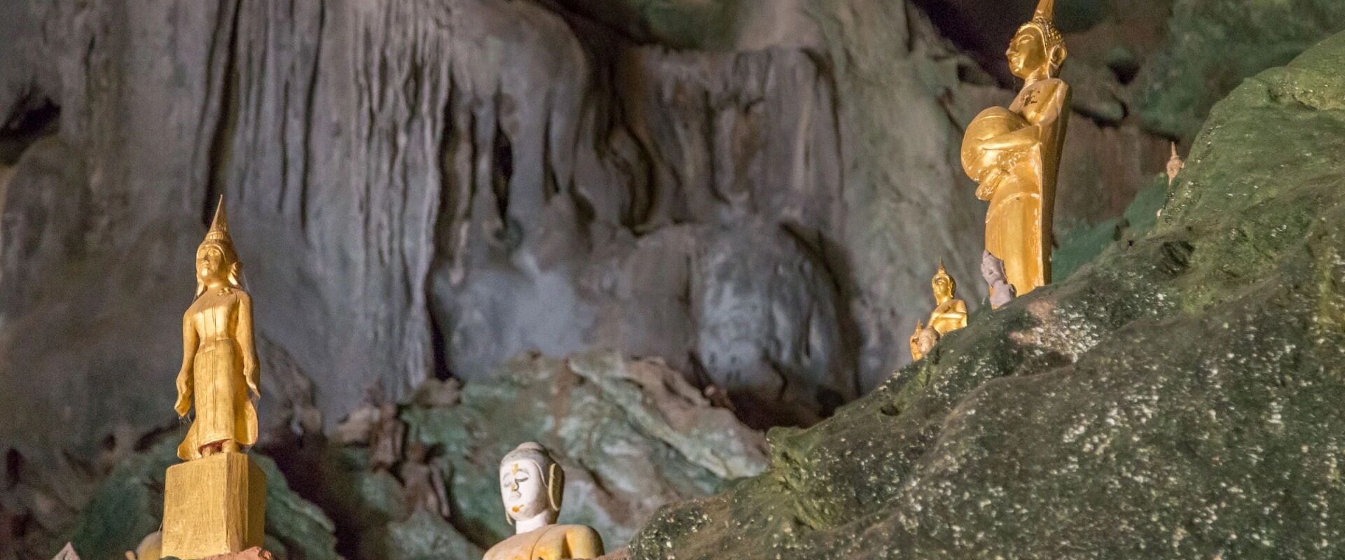 Misty Pak Ou Caves at sunset for a Pak Ou Travel banner by Legend Travel Group.